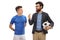 Father with a football explaining something to his teenage son