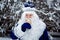 Father Frost is eating ice cream. Funny shot. Winter. Russian Christmas character Ded Moroz