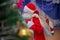 Father Frost speaks with a microphone . Santa Claus is singing Christmas songs against . Man in Santa Claus suit posing