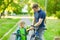 Father gives his son a bicycle helmet