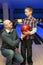 Father gives son ball for bowling