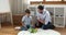 Father giving high five, play bricks with son at home