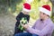 Father Giving Young Daughter Christmas Gift Outdoors