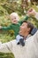 Father giving young son ride on shoulders