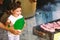 Father, Grandfather And Daughter Barbequing.