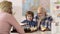 Father, Grandfather and son playing chess at home. Games and activities for children. Family concept. Educational games.