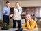 Father and grandmother scolding teenage girl