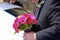 Father of the groom carrying flowers