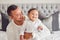 Father, happy and relax with baby in bedroom, family home and house for bonding, relax and playful morning together. Dad