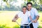 Father helping daughter bike