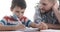 Father helping son studying at home