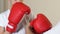 Father helping son to put on boxing gloves, training at home, sport education