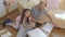 A father and his beautiful little daughter study together the instructions for assembling new furniture. The concept of