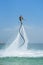 Father and his daughter posing at new flyboard at Caribbean tropical beach. Positive human emotions, feelings, joy. Funny cute chi