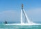Father and his daughter posing at new flyboard at Caribbean tropical beach. Positive human emotions, feelings, joy. Funny cute chi