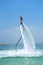 Father and his daughter posing at new flyboard at Caribbean tropical beach. Positive human emotions, feelings, joy. Funny cute chi