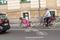 Father with his daughter riding bicycle at city street, safety concept