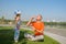 Father and his little daughter intently inflate soap bubbles