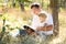 Father with his little daughter reads the Bible
