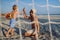 Father with his son plaing football on the beach.