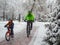 A father and his young son spend an active weekend in the winter on bicycles