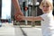 Father holding the daughter/ child hand behind the traffic lights