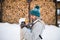 Father holding son in baby carrier. Winter nature.