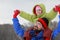 Father holds daughter on shoulders and glad