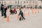 Father holds smiling baby in his armslittle boy in a protective helmet on amateur competition of children to balance bicycle on Le