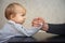 Father and kid arm wrestling competition