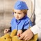 Father and kid with curious and happy face playing doctor.