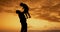 Father, kid and lift in sunset with silhouette, spin and airplane games with clouds in nature on holiday. Person, child