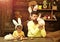 Father kid painting Easter eggs. Rabbit`s family bunny ears.