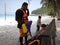 Father and kids waiting for a speedboat trip in a tropical island.