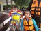 Father and kids waiting for a speedboat trip in a tropical island.