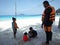 Father and kids waiting for a speedboat trip in a tropical island.