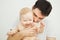 Father kisses his adorable necked toddler in shoulder, happy fatherhood