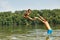 Father in the lake throwing his daughter into the water