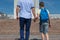 Father leads his son up the stairs to school, close-up