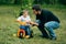 Father learn kid to ride a small bicycle