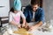 Father and little daughter baking pastries. Family having fun in kitchen and getting ready for a party.