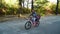 Father and little daughter on bike ride in park