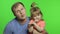 Father and little daughter making faces to camera. Chroma Key. Fathers day