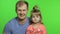 Father and little daughter together looking to camera. Chroma Key. Fathers day