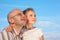 Father and little girl on sky background