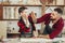 Father and little son giving high five while visiting woodworking masterclass.