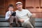 Father and little son with retro camera outdoors