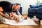 Father making funny gestures to his baby daughter while changing his diaper