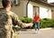 Father in military uniform and little daughter running to him