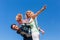 Father, mother and daughter playing plane